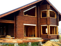 Дом в два этажа из оцилиндрованного бревна